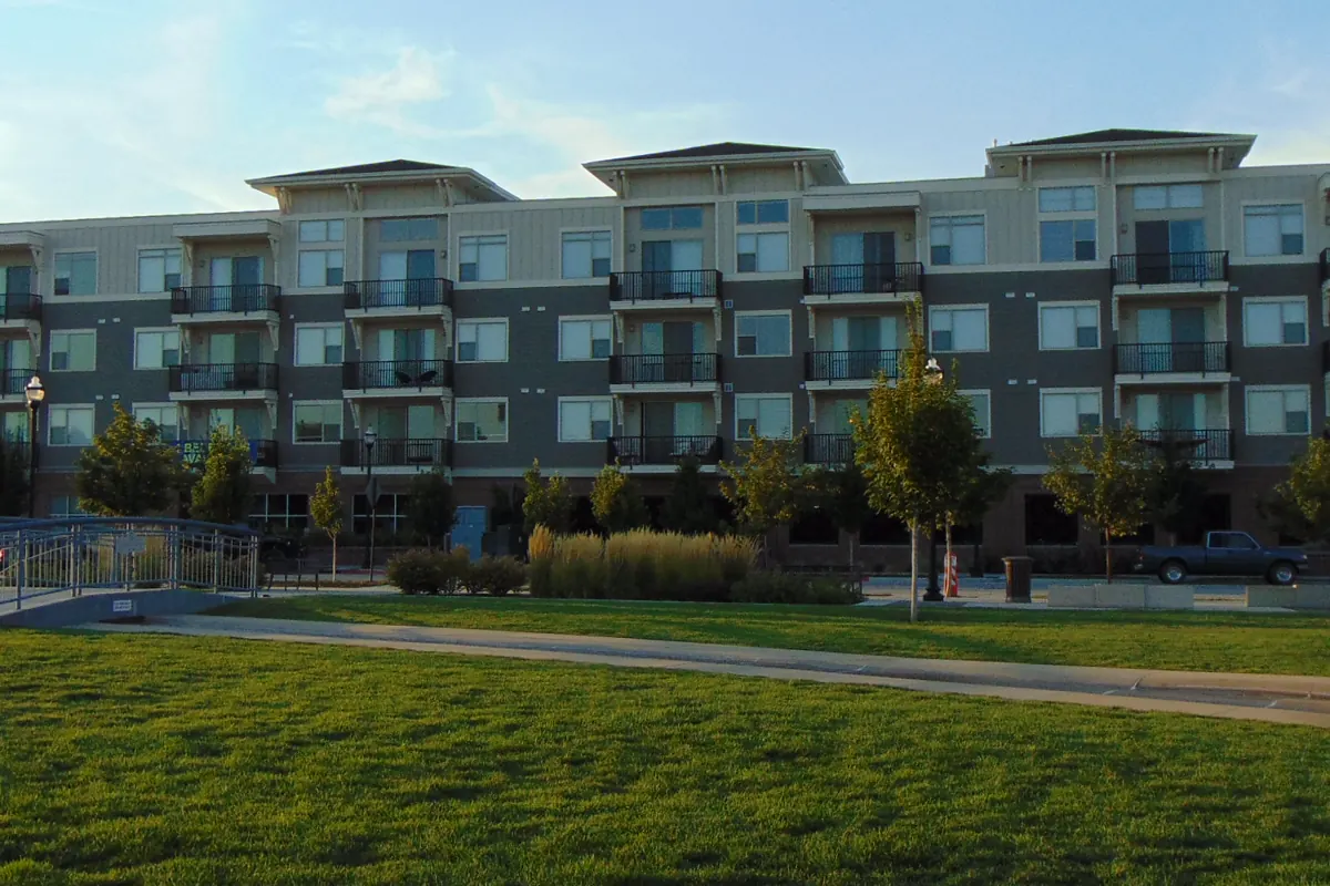 Illustrative photo, not this property: a modern four-story condominium building