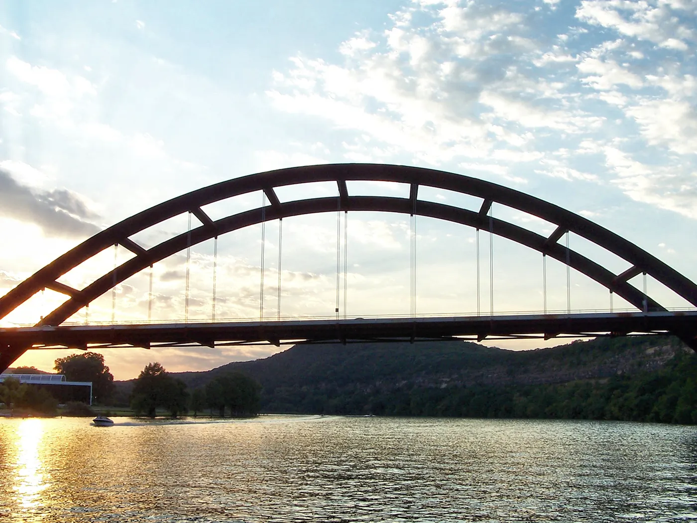 Pennybacker Bridge arching over Lake Austin at sunset